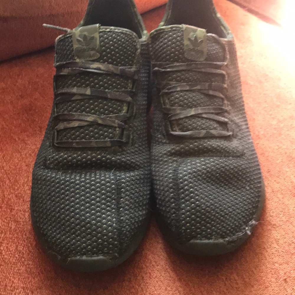 Adidas camo tennis shoes.